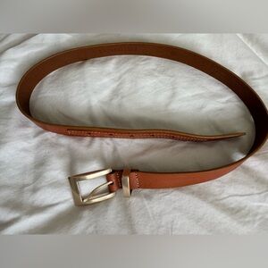Fossil, genuine, leather belt in cognac with silver buckle size medium.